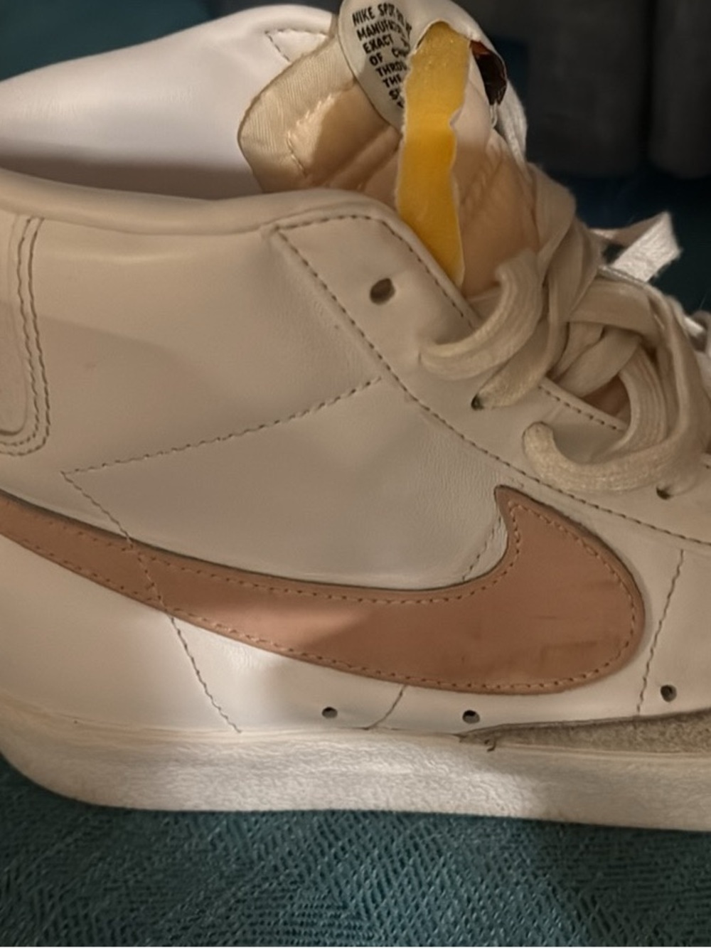 Nike Women’s High-Top Sneakers in White with light pink Swoosh